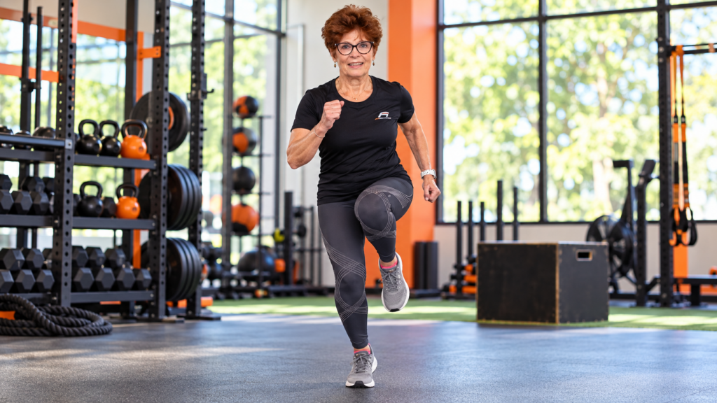 Postmenopausal woman performing a single-leg hopping exercise to improve hip bone density