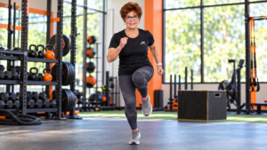 Postmenopausal woman performing a single-leg hopping exercise to improve hip bone density